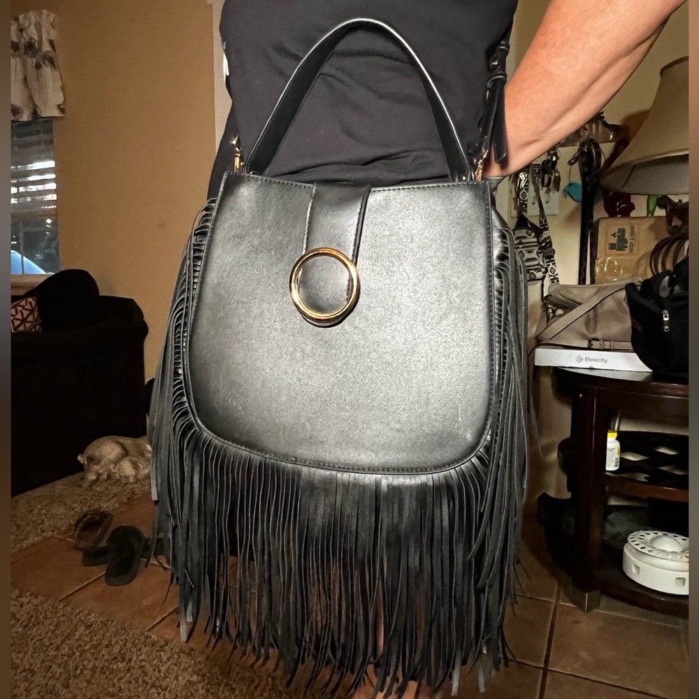 Black Venus crossbody/shoulder bag with fringe.
